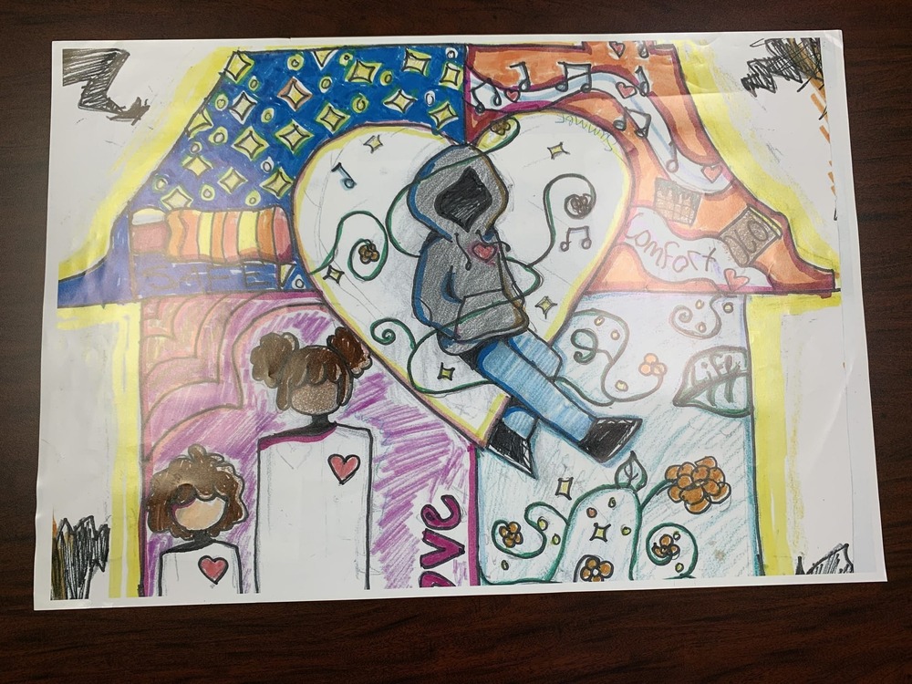 October winning drawing shows a person wearing a hoodie surrounded by music notes and other things that makes up their home.