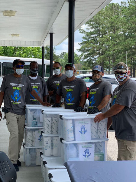 RCHA staff next to the CARE Kits.