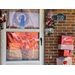 Wrapped presents and wrapped door with garland around the top. 