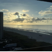  A beach view with a sunrise. 